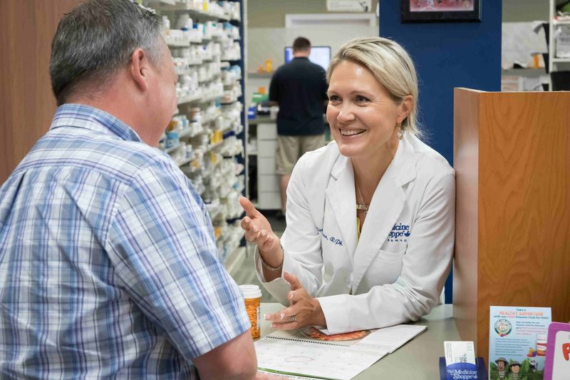 Pharmacist assisting a patient at Med-Save Carter Medicine Shoppe